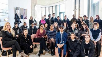 Jimmy Choo (centre right) with young people from Fulham Cross School in White City