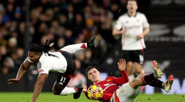 Adama Traore is challenged by Manuel Ugarte