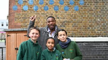 Dr Jak Beula with Wendell Park pupils, from left to right: Felix, Efrata, and Noah