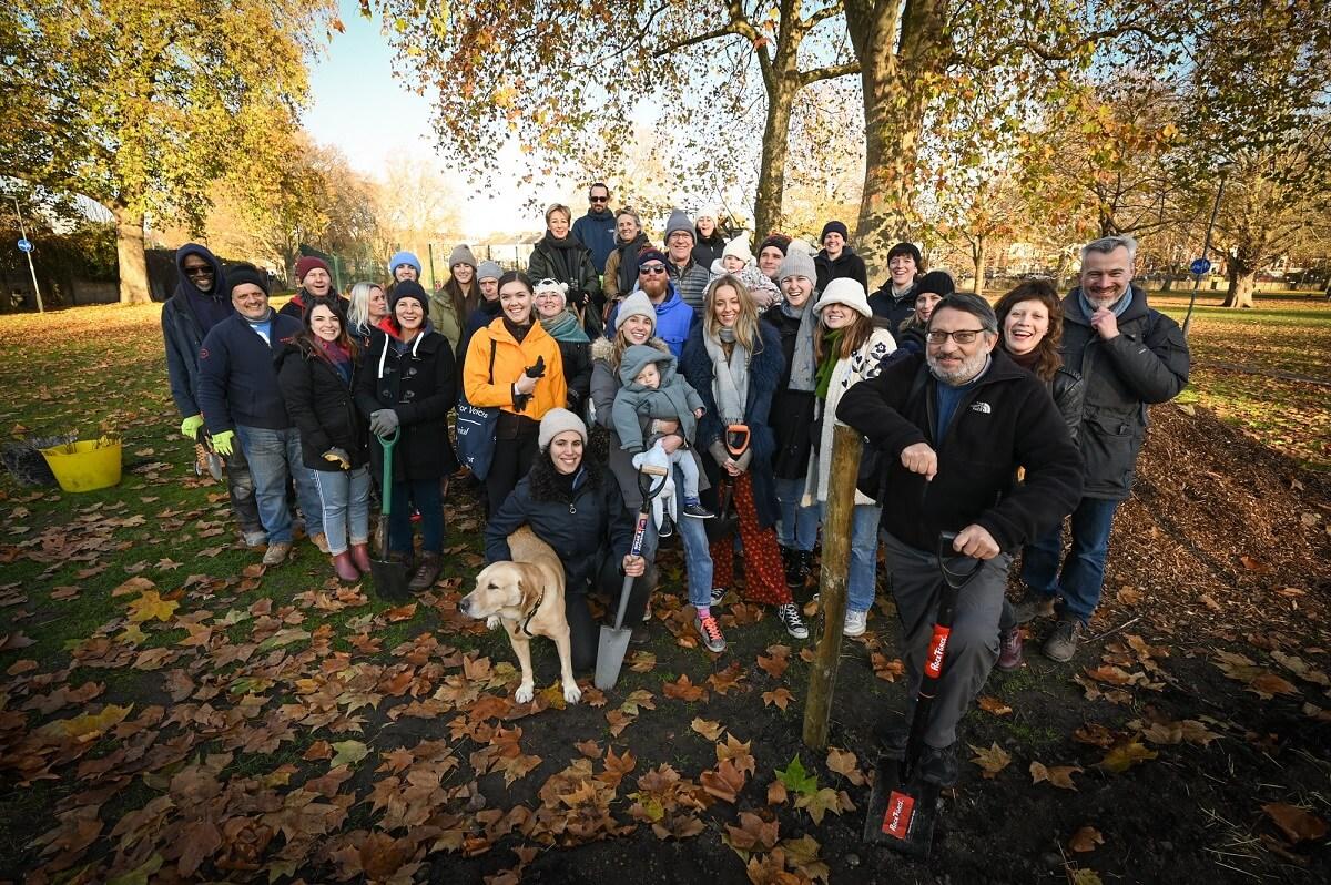 Cllr Wesley Harcourt (front right) with Caroline Marston from Marston Properties (top centre) and local volunteers planting Eelbrook Common's Tiny Forest.