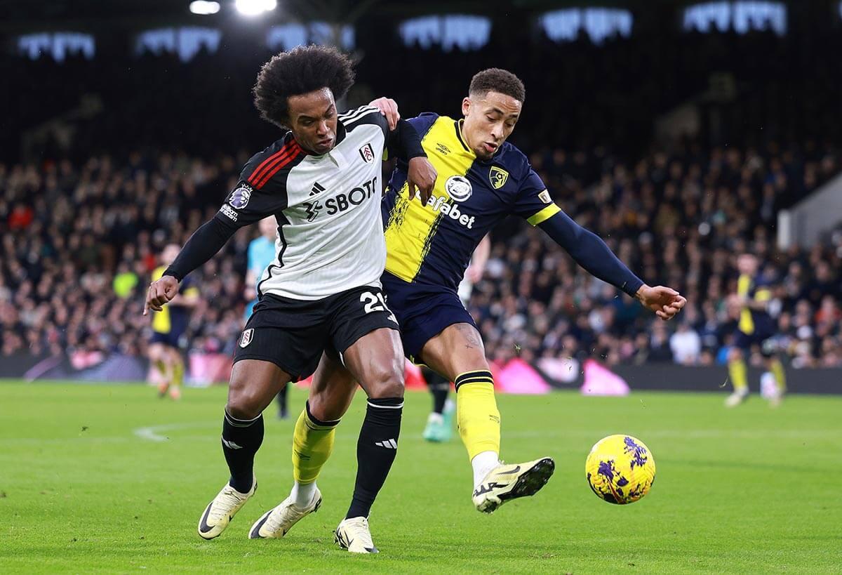 Fulham's Willian (left) and Bournemouth's Marcus Tavernier (right) challenge for the ball at Craven Cottage