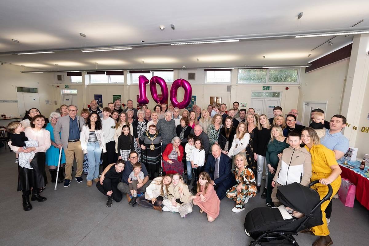 Peggy Baker (seated centre) celebrating her 100th birthday with family and friends at White City Community Centre