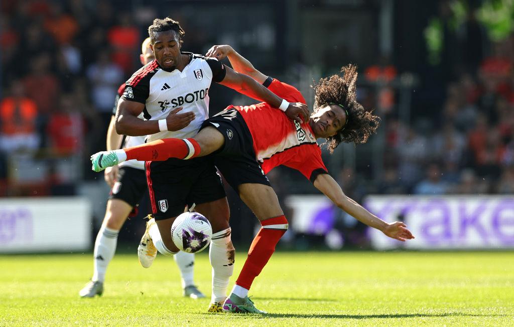  Tahith Chong of Luton Town is challenged by Adama Traore