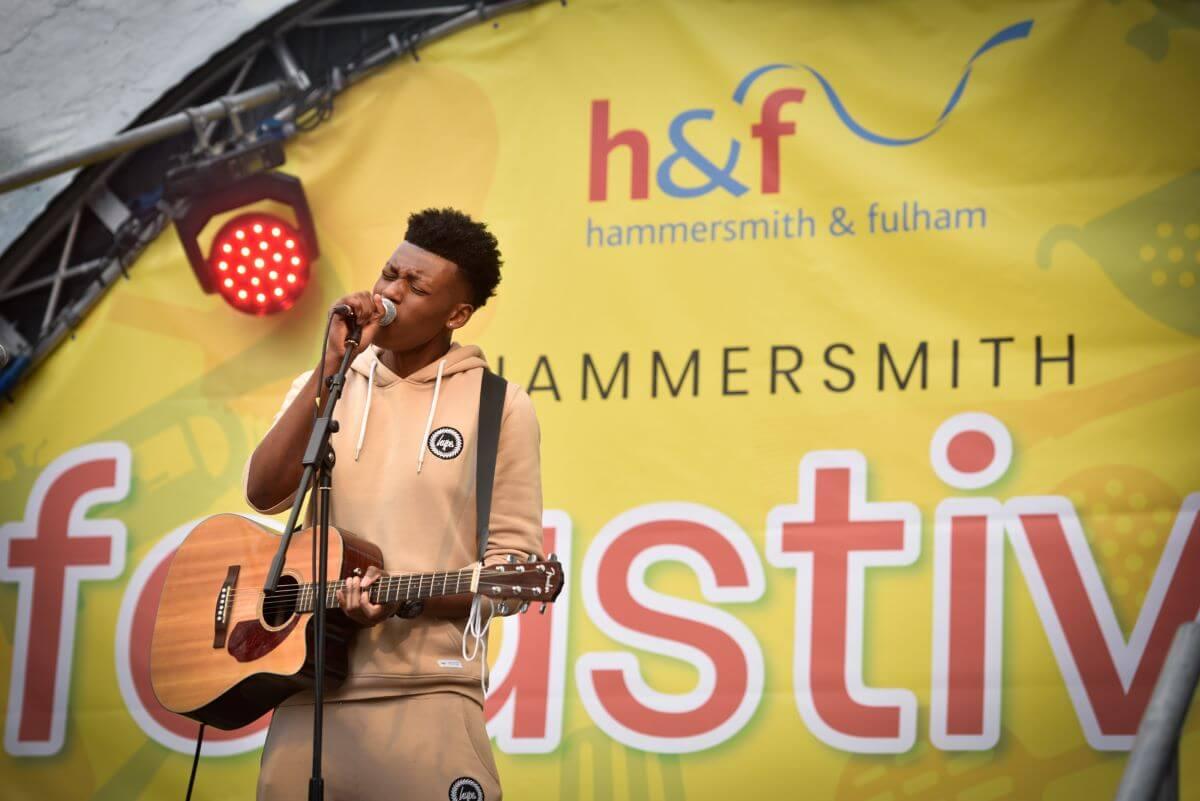 Performer on stage at Hammersmith summer street festival