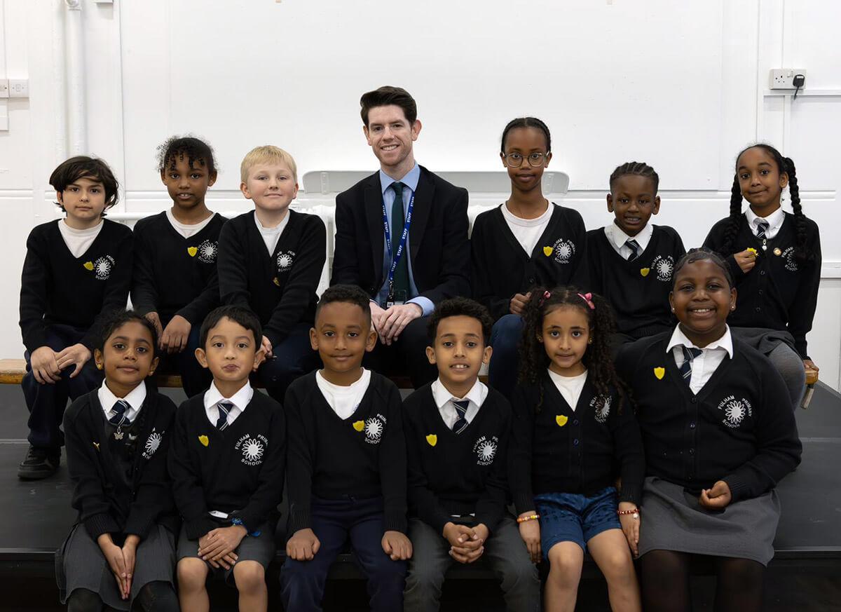 Fulham Primary head John Lynch (centre, back row) with school council members