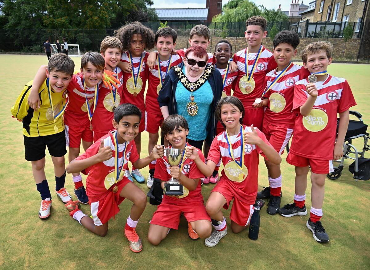 Fulham's Holy Cross boys celebrate their win with Cllr Patricia Quigley (centre), Mayor of H&F