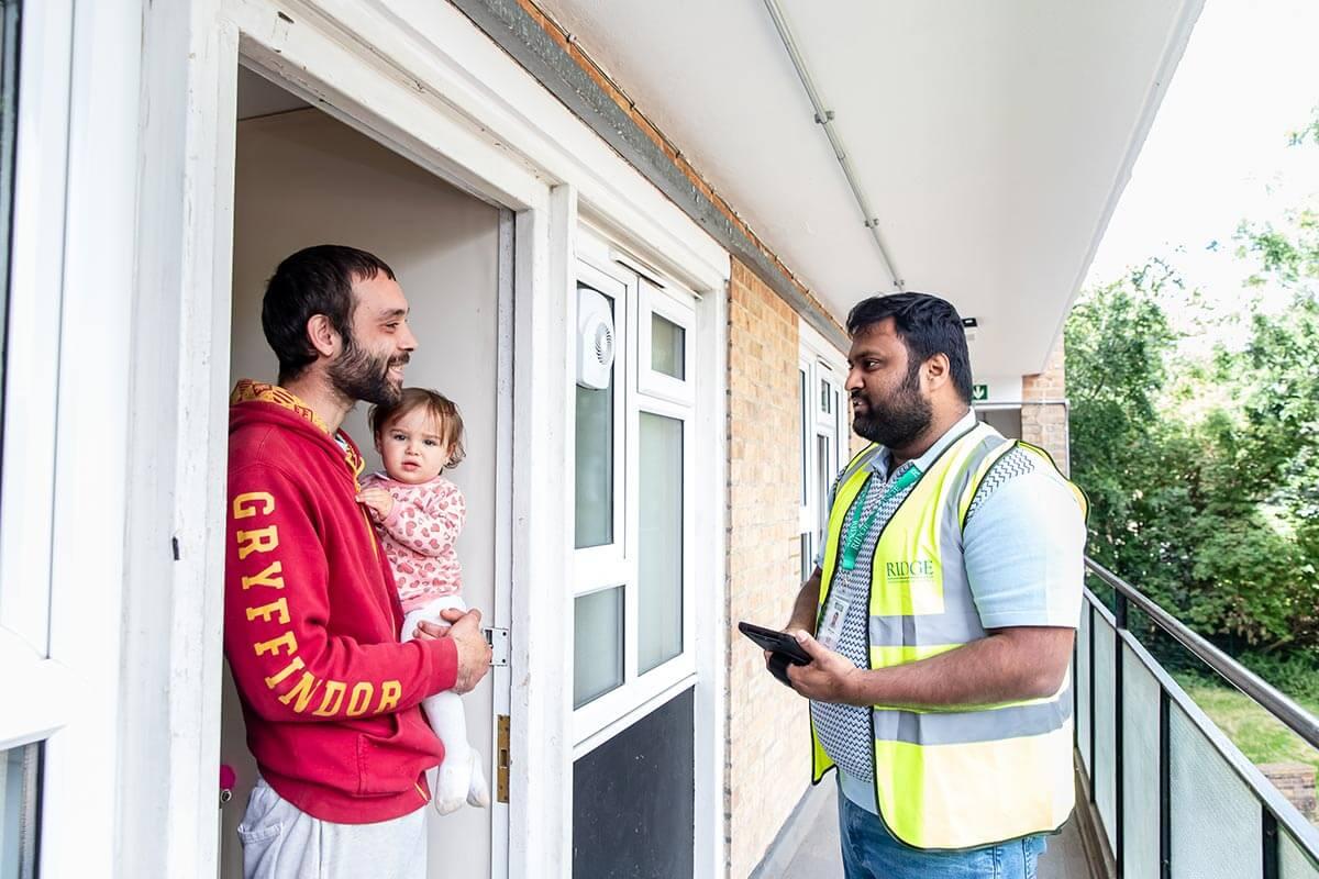 A surveyor from Ridge and Partners LLP visiting an H&F resident