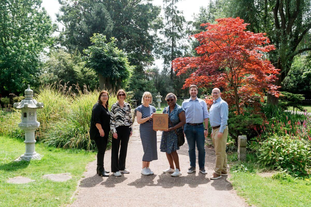 Cllr Holder (centre right) accepts Deed of Dedication with representatives from Fields in Trust in Hammersmith Park