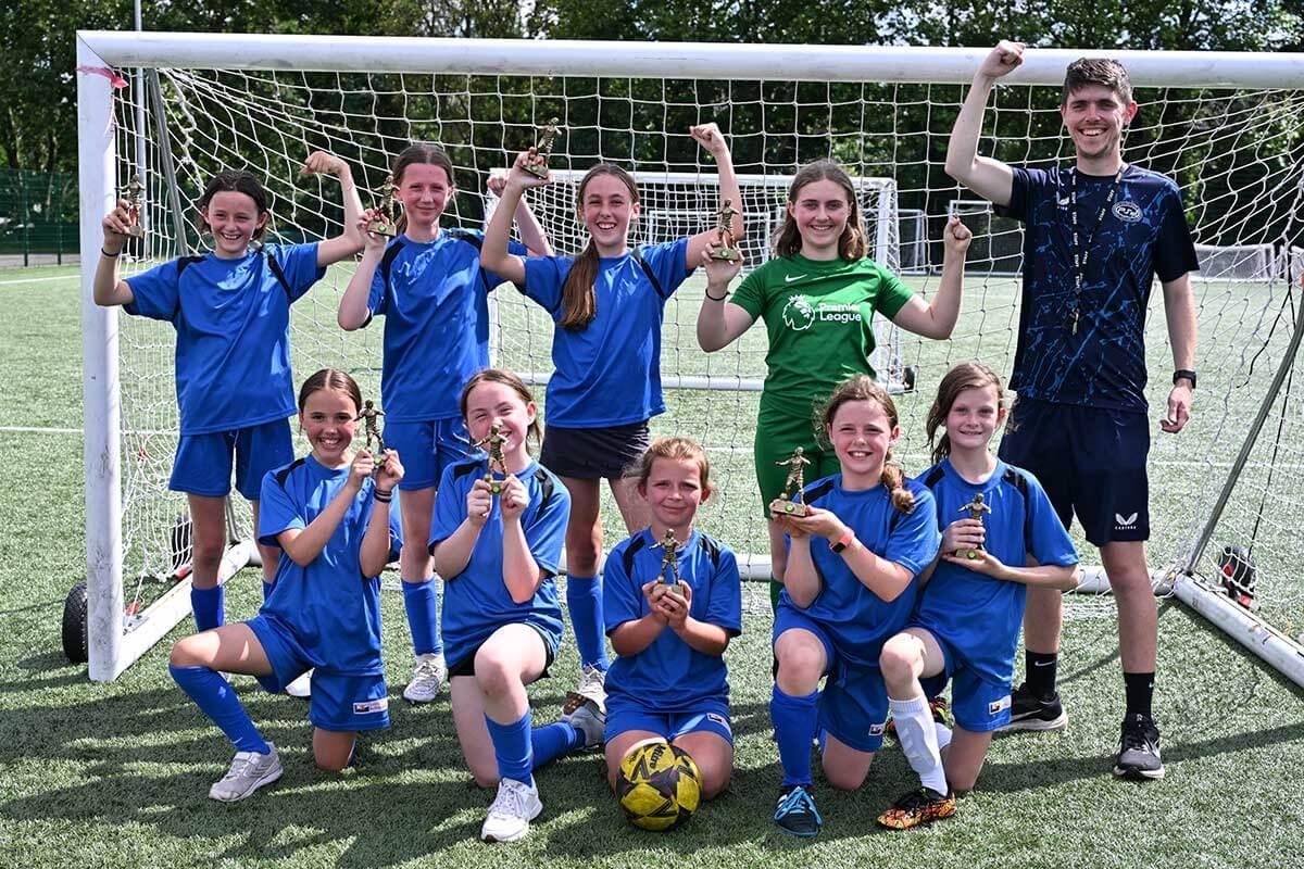 St Peter’s, winners of the girls’ half of the annual Mayor’s Cup, with team coach Jake Webb (far right)