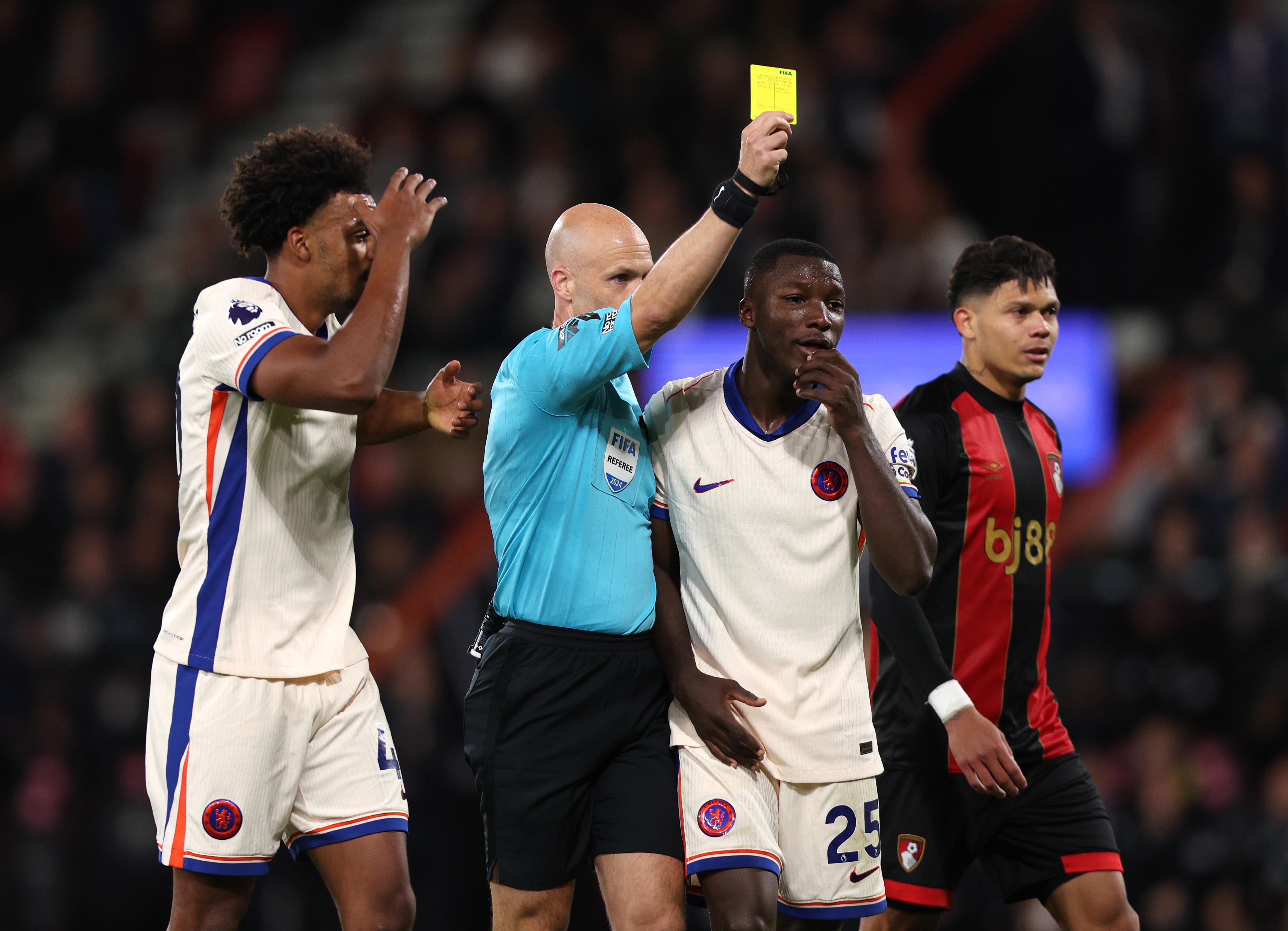 Referee Anthony Taylor shows one of many yellow cards