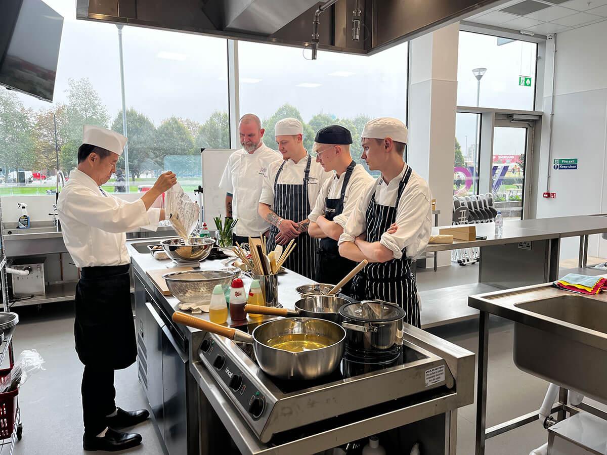 Chef Yoshihiko ‘Sushi Yoshi' Shida teaching students from North Hertfordshire