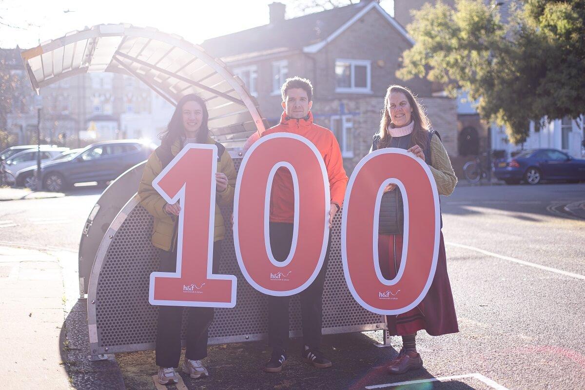 Milestone celebration in Trevanion Road, W14. F-l-t-r: Local resident Victoria Gomez, Tom Pelling (Key Account Manager, Cyclehoop) and Philippa Robb (Senior Smarter Transport Officer, H&F)