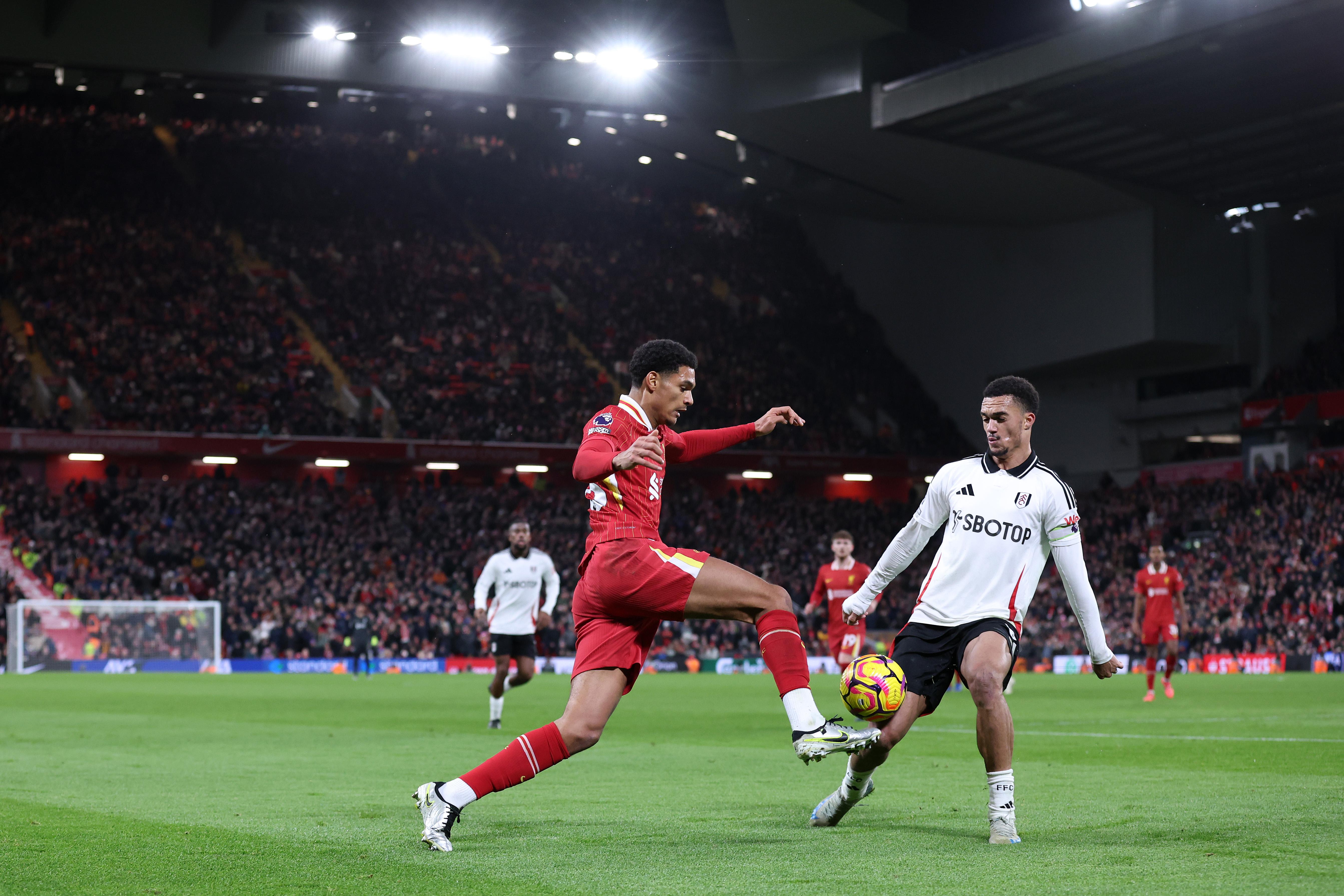 Jarell Quansah of Liverpool is challenged by Antonee Robinson