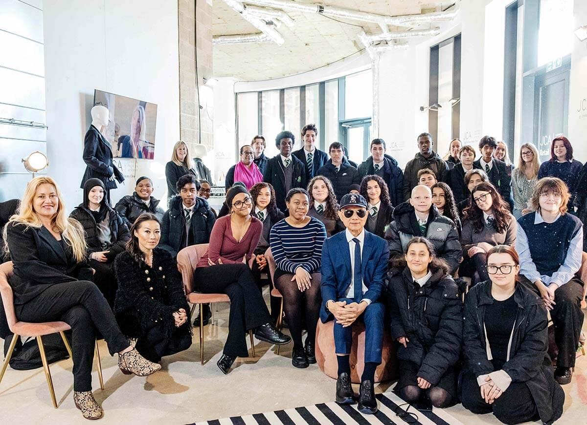 Jimmy Choo (centre right) with young people from Fulham Cross School in White City