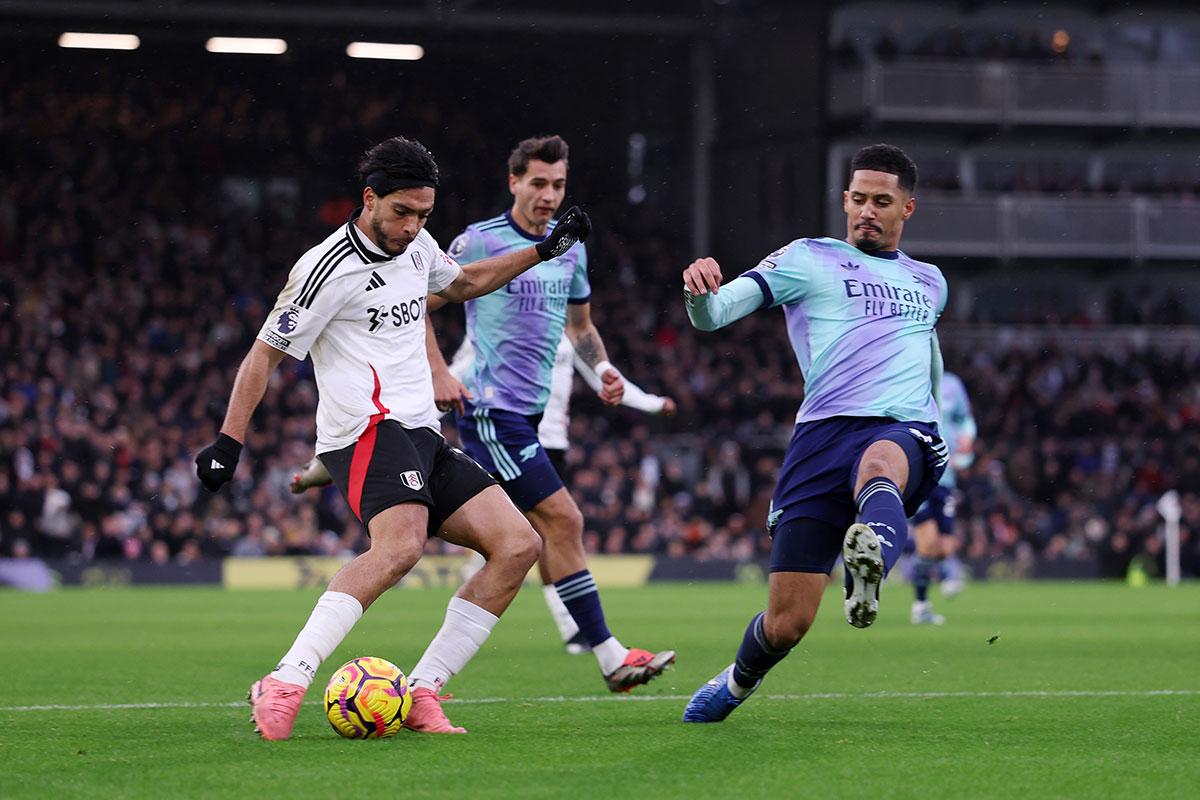 Raul Jimenez (left) scores for Fulham under pressure from Arsenal's William Saliba