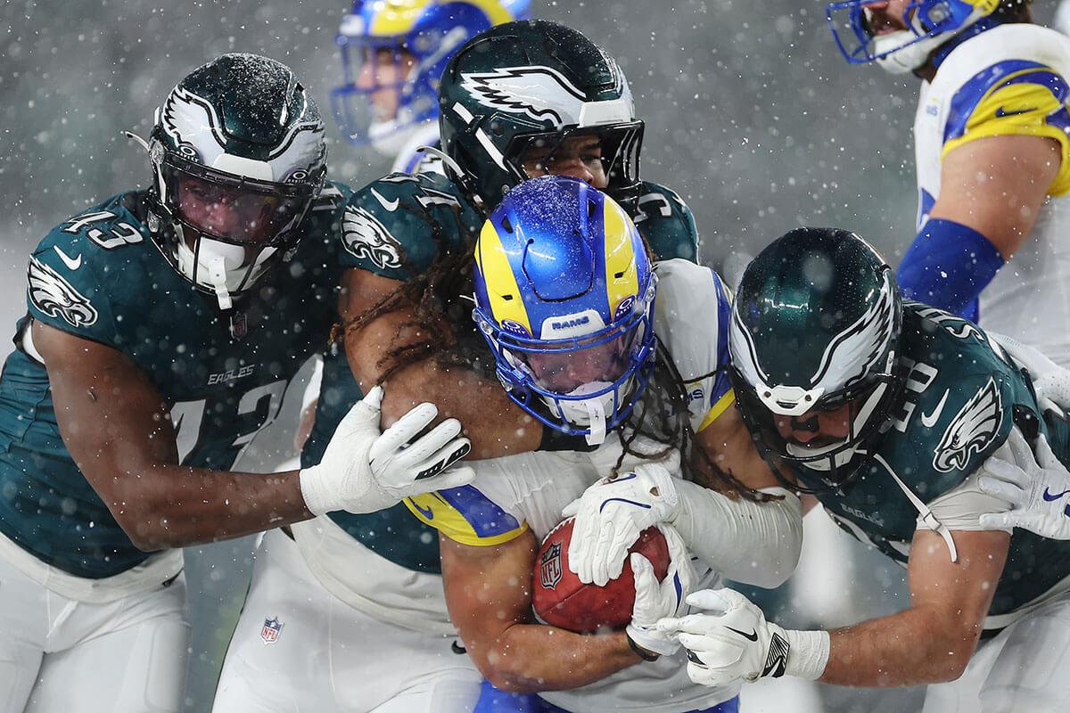 Jordan Whittington of the Los Angeles Rams is tackled by the Philadelphia Eagles during the NFC Divisional Playoff game