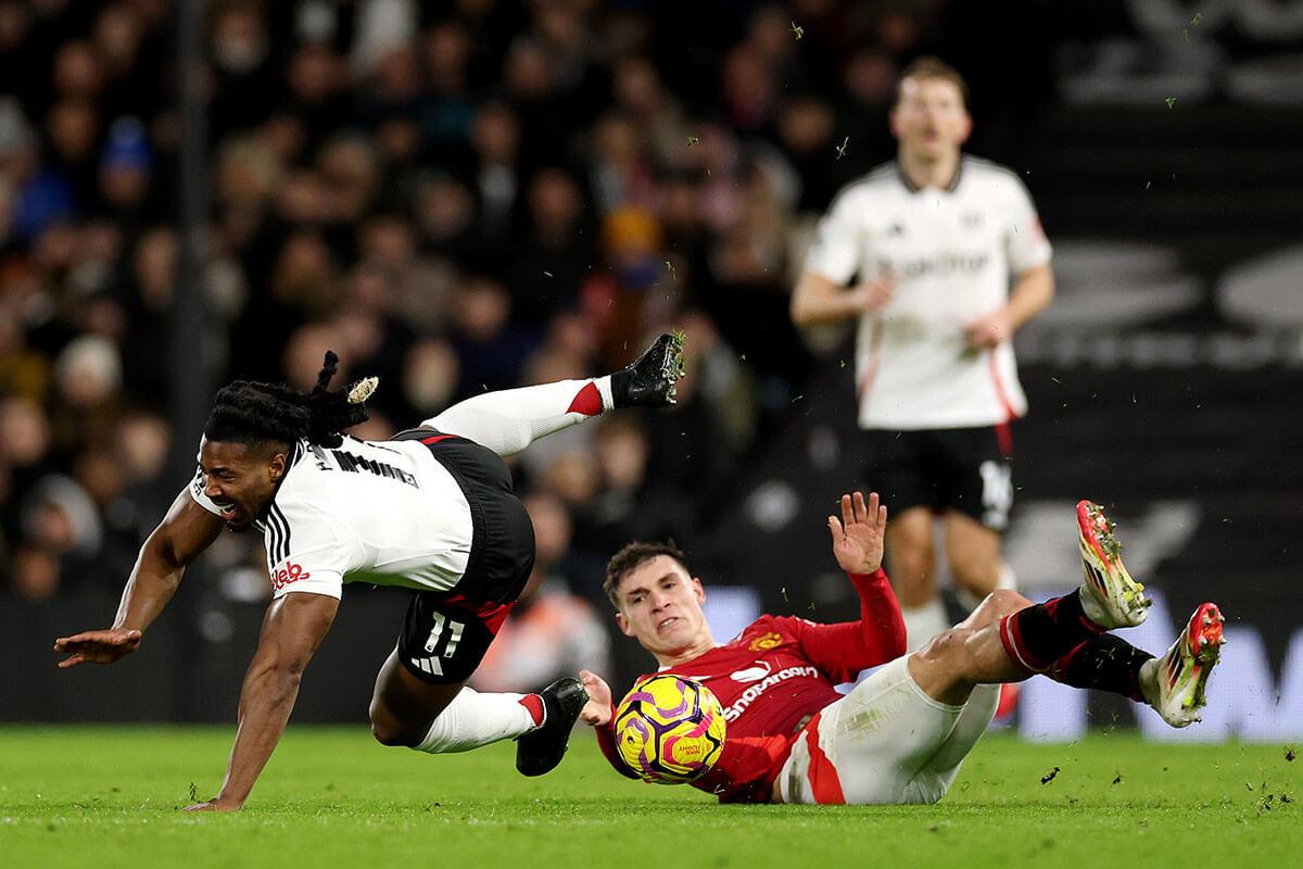 Adama Traore is challenged by Manuel Ugarte