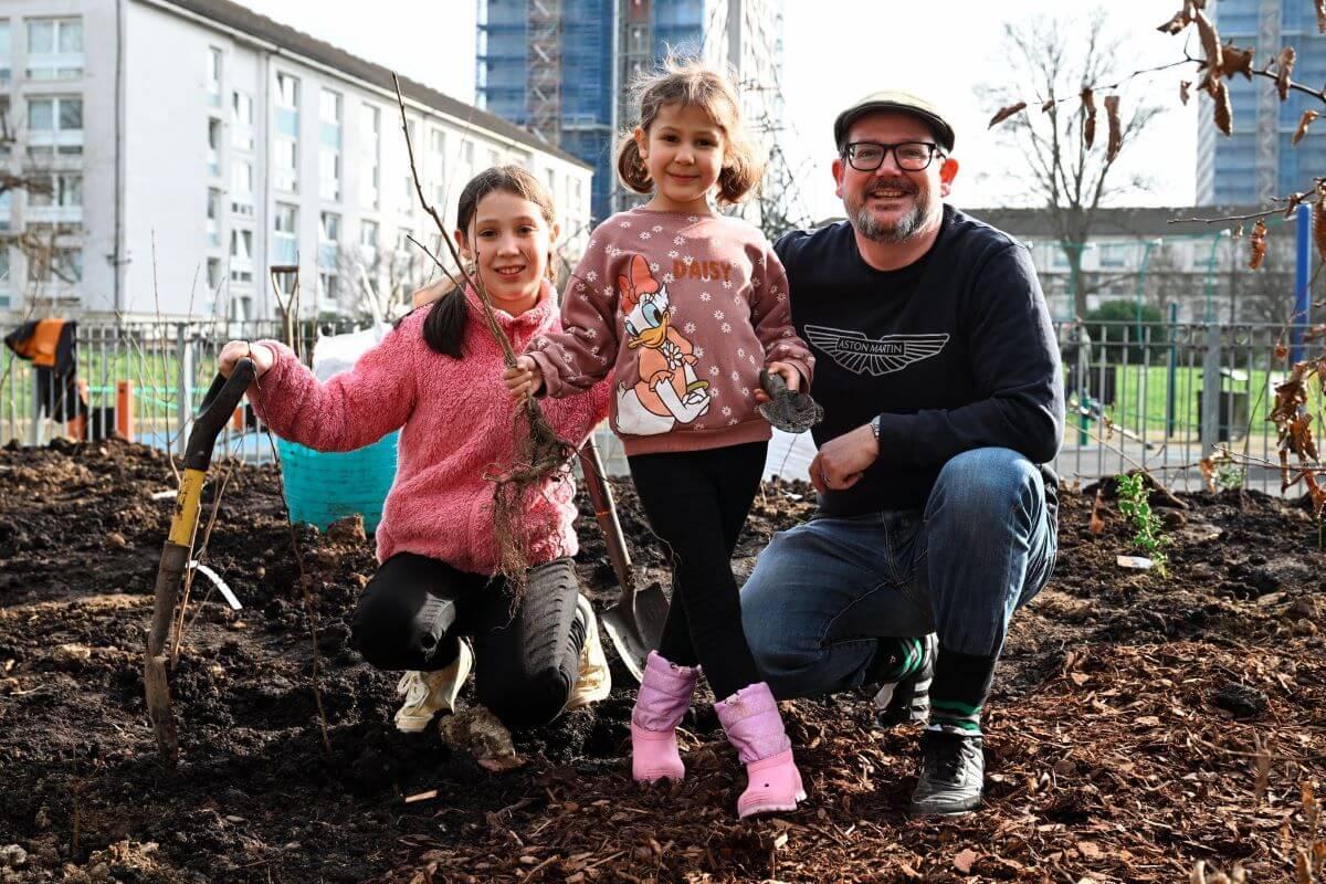 One local family joins in the planting at Norland Open Space