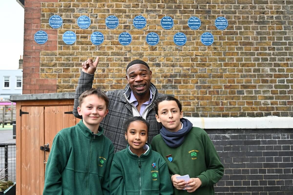 Dr Jak Beula with Wendell Park pupils, from left to right: Felix, Efrata, and Noah