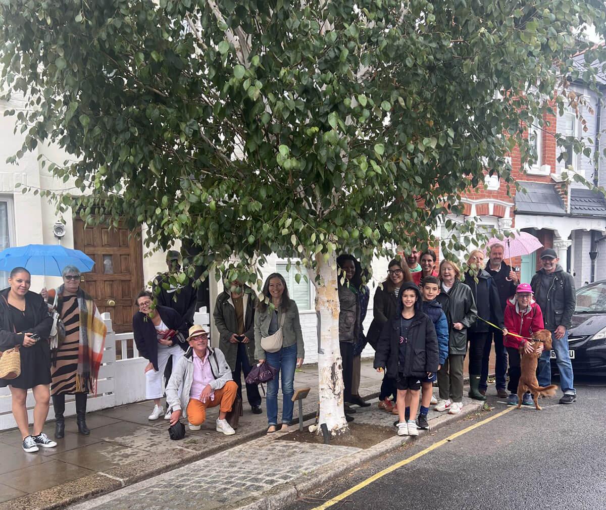 Fred Thompson's neighbours alongside the silver birch tree in Thorpebank Road, Shepherds Bush