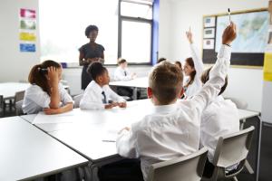 Children in a classroom. Credit: monkeybusinessimages