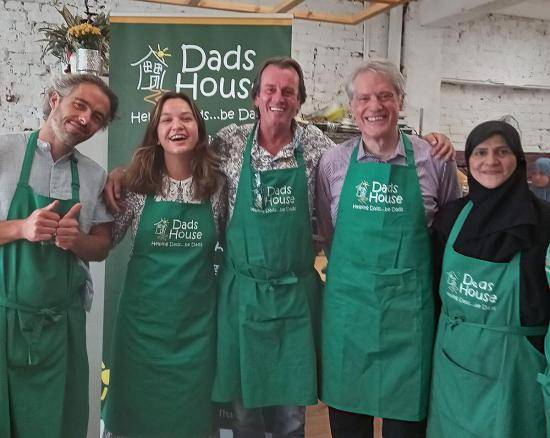 Dads House founder William McGranaghan (centre) and Cllr Ben Coleman (second from left) with Dads House team members