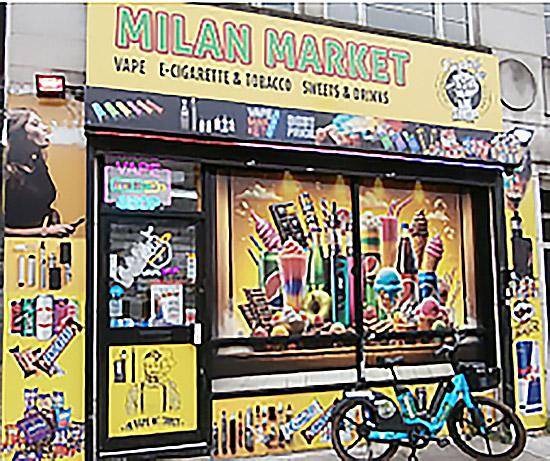 Bright yellow posters blanking the windows of Milan Market