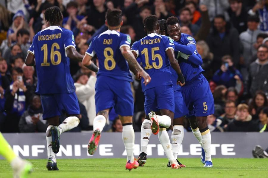 Benoit Badiashile celebrates with his teammates after scoring the opening goal.