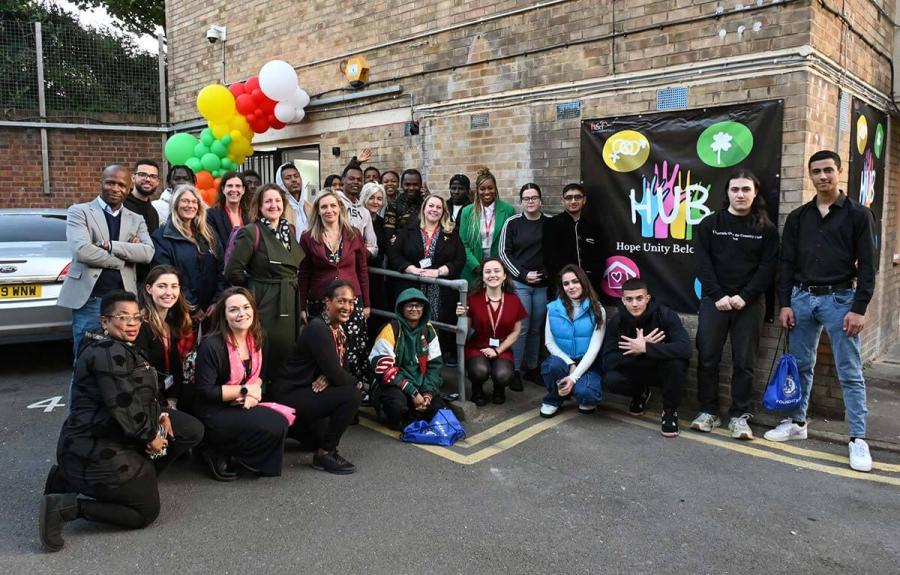 Care leavers and their social workers join council officers and Cllr Alex Sanderson (centre) at the launch of their community hub