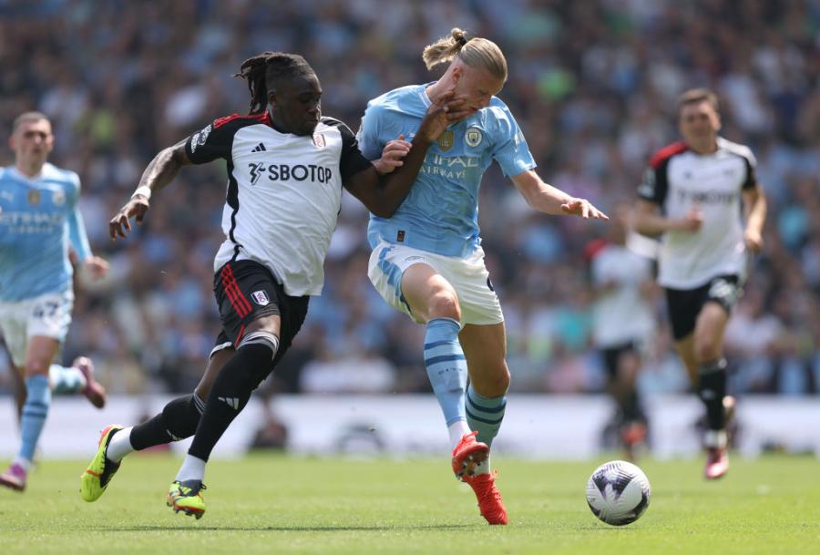Erling Haaland of Manchester City is tackled by Calvin Bassey