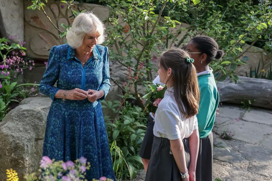 HRH Queen Camilla vists the children's garden.