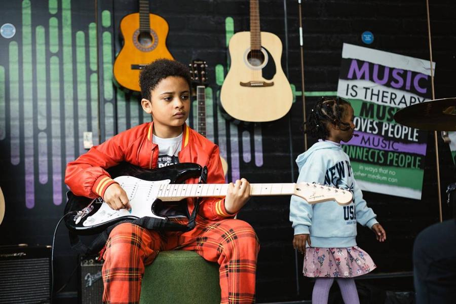 WEST YouthZone has a music room where young people can make music and learn to play instruments like the electric guitar and drums.