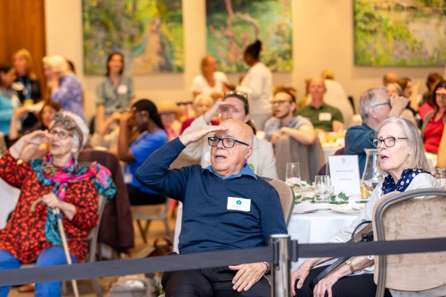 Residents join in with the singing and hand movements