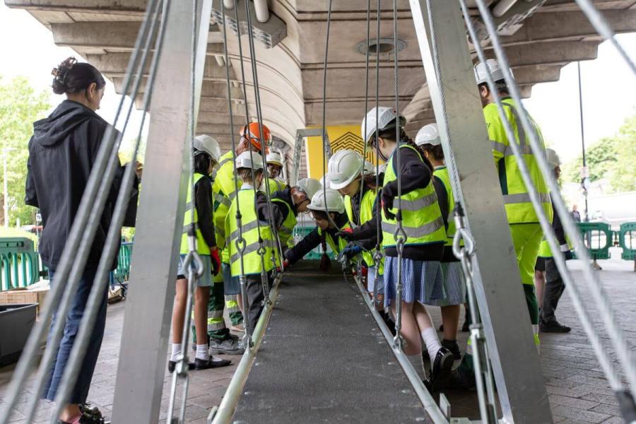 Students assemble a 13-metre bridge