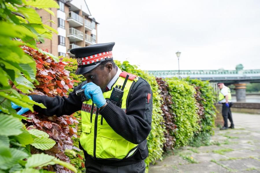 LET officer conducting a weapon sweep along the Thames footpath in Fulham