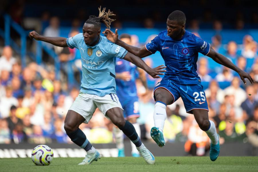 Moises Caicedo tackles with Jeremy Doku