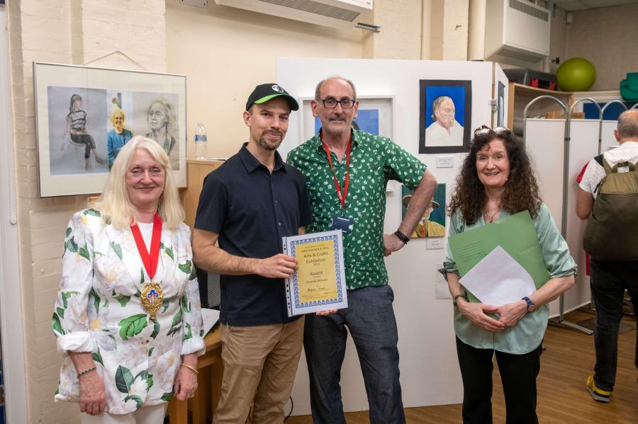 Pictured from left to right: Cllr Daryl Brown, Deputy Mayor of H&F; Andrew Attwell, overall winner of the exhibition; Tim Cunliffe, arts lecturer; and Jane Sutton, arts and crafts programme manager