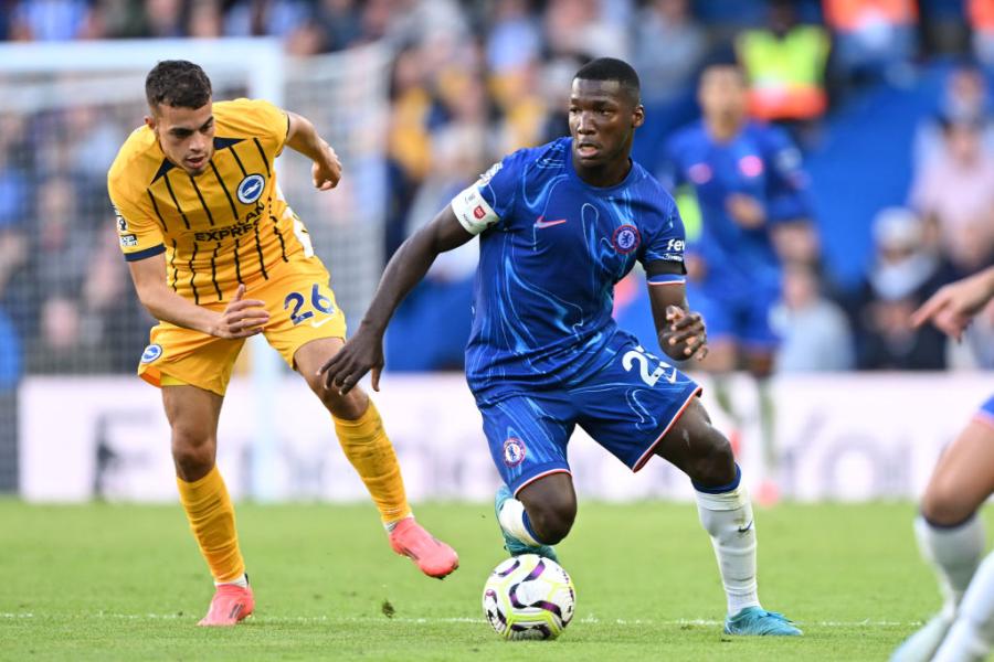 Moises Caicedo of Chelsea is challenged by Brighton's Yasin Ayari