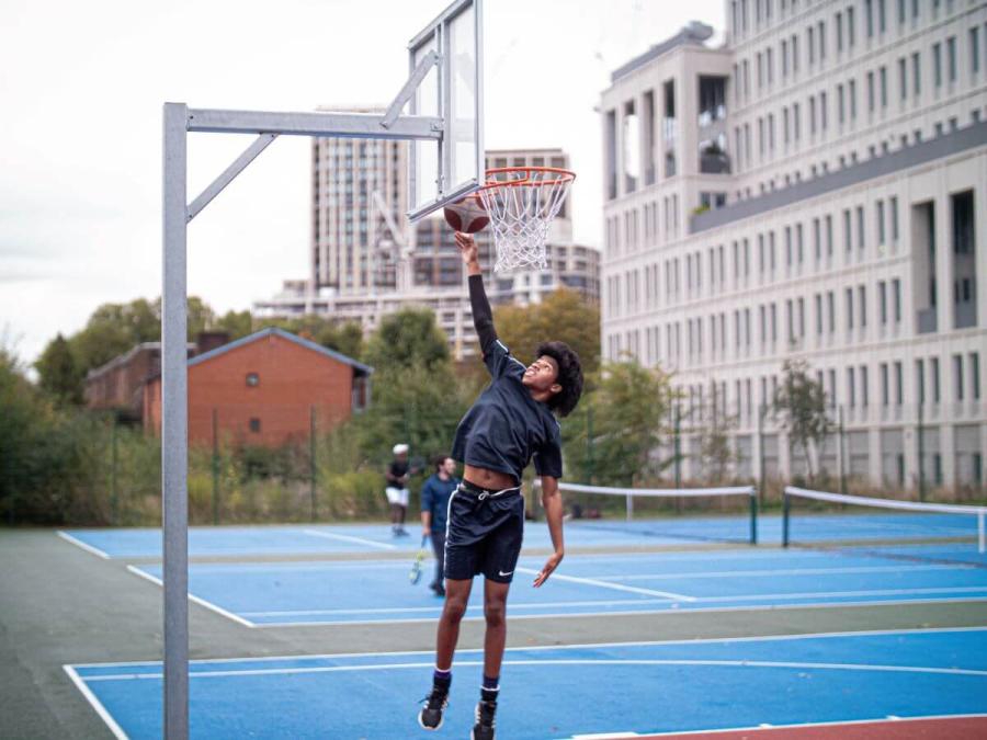 Residents playing basketball in Hammersmith Park