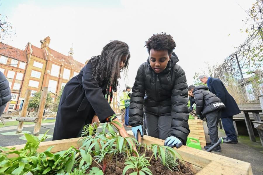 Cllr Frances Umeh (left) with a pupil at Sir John Lillie primary school