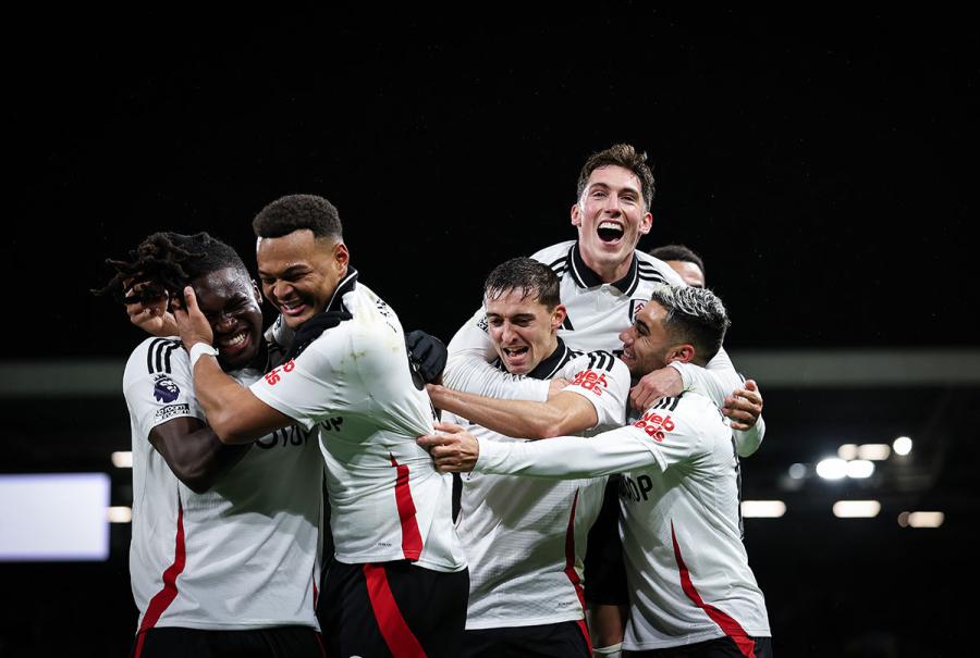 Fulham celebrate their second goal, and own goal by Matt O'Riley of Brighton