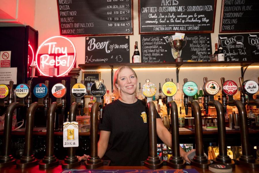 Sylwia Staron behind the bar at The Stonemasons Arms