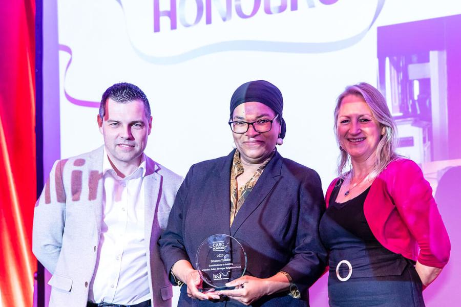 Sharon Tomlin (centre) receiving her H&F Civic Honour award in 2023